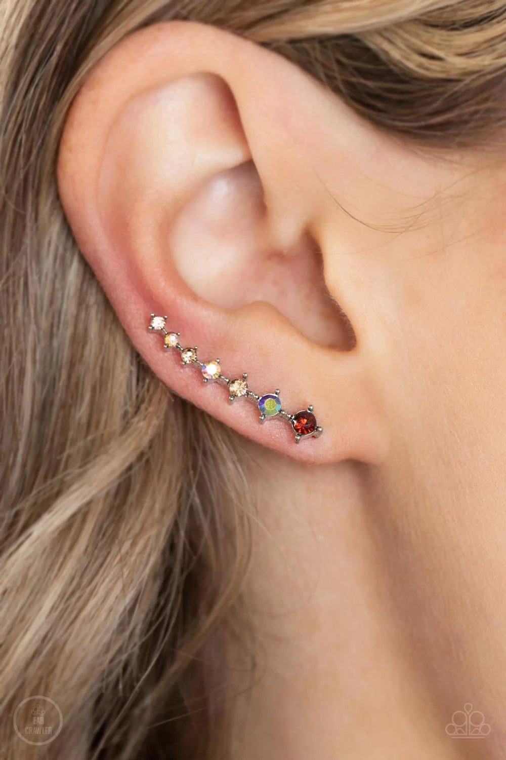 Paparazzi Accessories STARLIGHT Show - Brown An iridescent spectrum of dainty topaz rhinestones gradually increase in intensity as they climb the ear for a stellar fashion. Features an extended post fitting that climbs the back of the ear and can be press