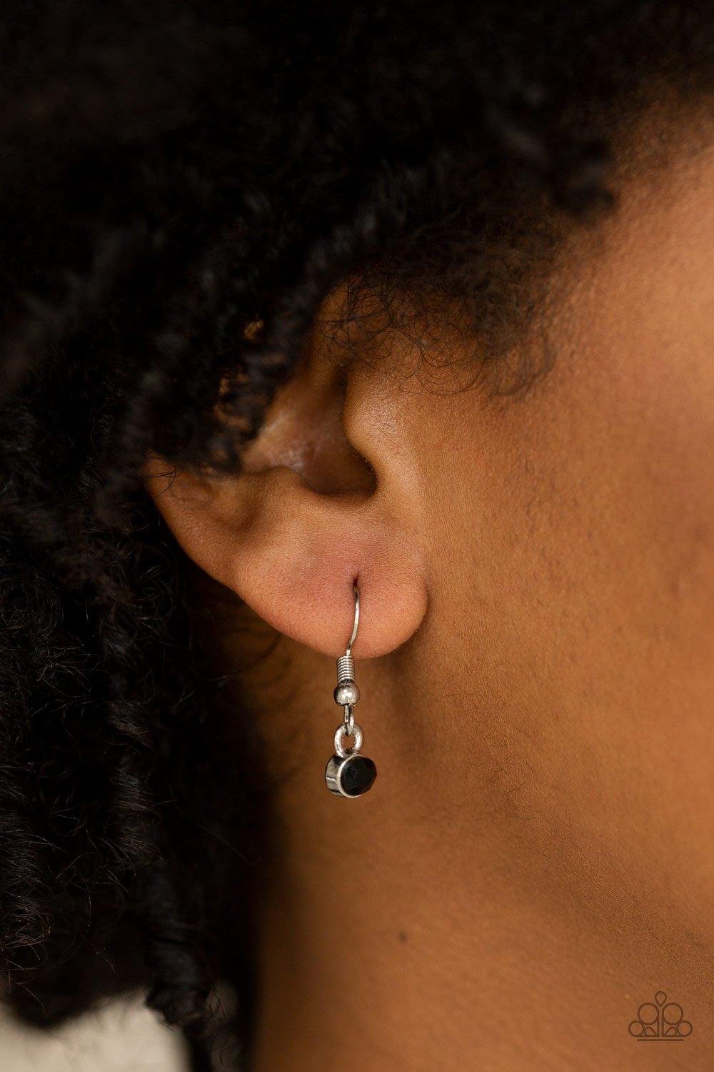 Paparazzi Accessories Front and EPICENTER - Black A daring circular pendant swings from the bottom of an elongated silver chain for a refined look. The bottoms of the ornate silver pendant are encrusted in black rhinestones for a glamorous finish. Feature
