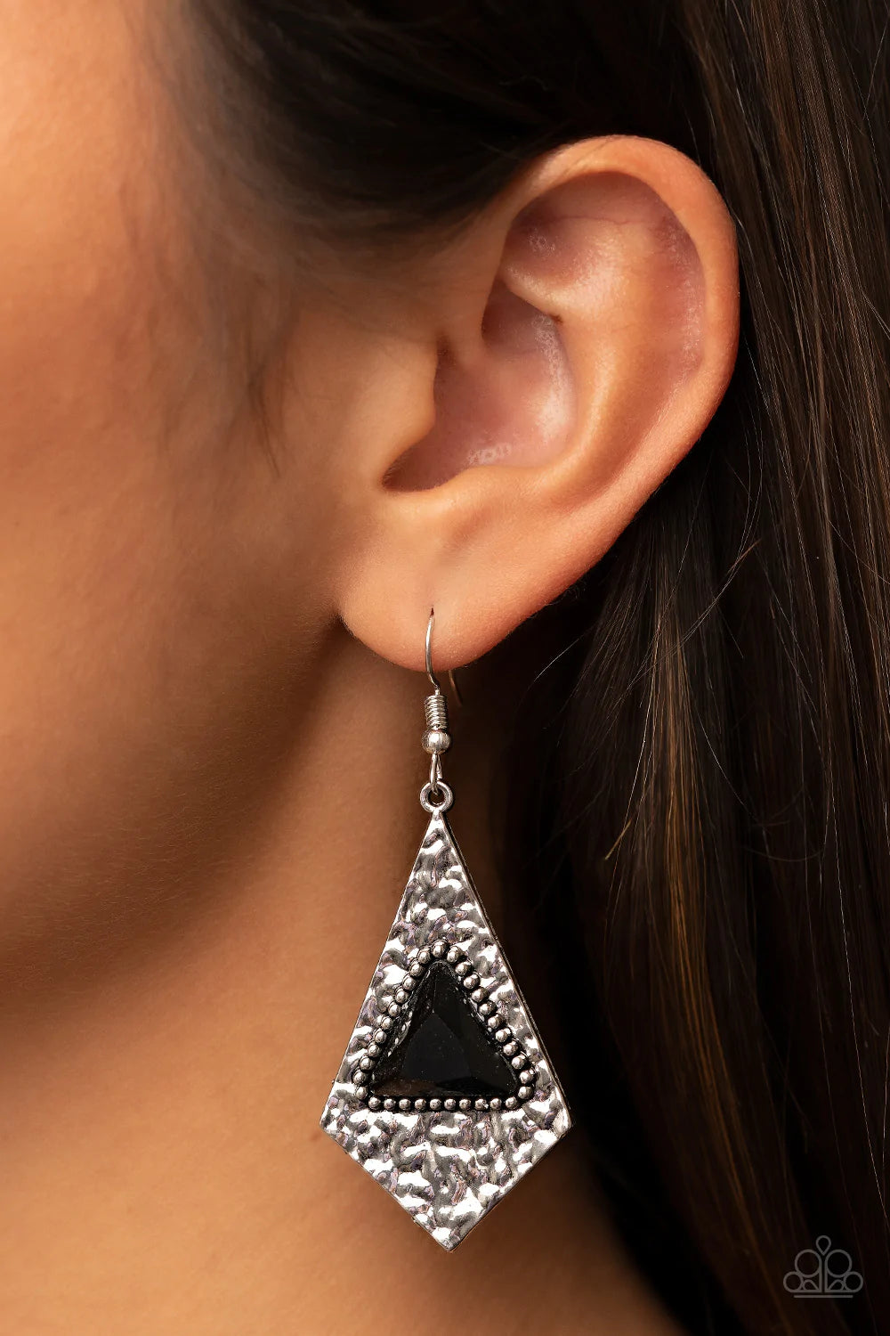 Paparazzi Accessories Cosmic Destination - Black Bordered in dainty silver studs, a black triangular gem is pressed into the center of a hammered silver kite shaped frame for an edgy shimmer. Earring attaches to a standard fishhook fitting. Sold as one pa