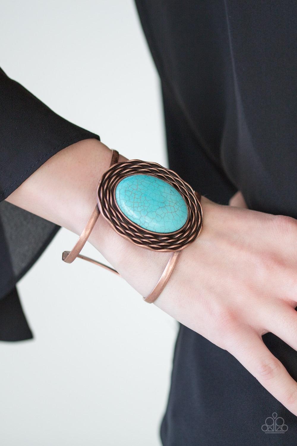 Paparazzi Accessories One For The Rodeo - Copper A refreshing turquoise stone is pressed into a rippling copper frame, creating a bold artisanal centerpiece atop an airy copper cuff. Jewelry
