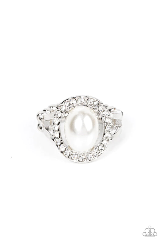 Paparazzi Accessories Seize the Shimmer - White An oval white pearl seemingly floats inside a glittery ring of white rhinestones atop layered bands of silver, resulting in a timeless centerpiece atop the finger. Features a dainty stretchy band for a flexi