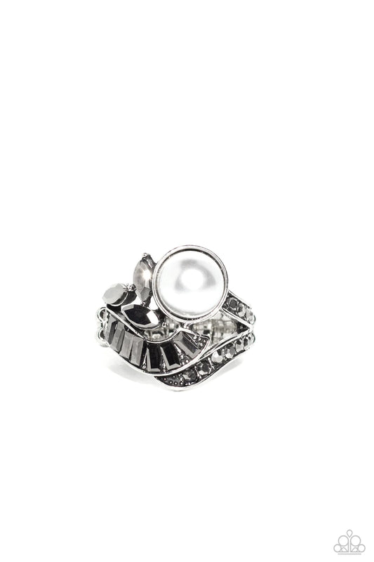 Paparazzi Accessories SELFIE-Made Millionaire - Silver Silver ribbons adorned in round and emerald cut hematite rhinestones delicately nestle around an oversized white pearl. Enhanced with a trio of marquise cut hematite rhinestones, the lavishly layered
