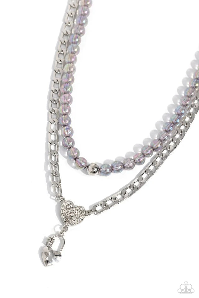 Paparazzi Accessories Turn Back The Clock - Silver Layered atop a bold silver elongated curb chain, a strand of gray clear beads featuring an iridescent shimmer is threaded along an invisible wire below the collar, resulting in a colorfully layered design