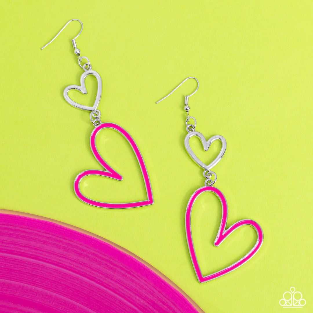 Paparazzi Accessories Pristine Pizzazz - Pink Dangling from an abstract silver heart frame, another heart frame, this time an oversized one, features a border of Pink Peacock paint, creating an attention-grabbing romantic statement below the ear. Earring