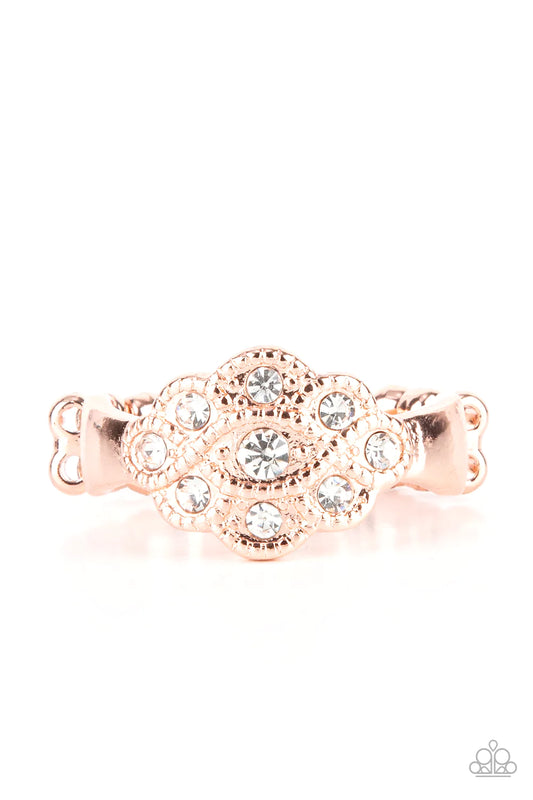 Paparazzi Accessories Floral Frou- Frou - Copper Dainty white rhinestones dot the front of a studded shiny copper floral frame, creating a glitzy centerpiece atop the finger. Features a dainty stretchy band for a flexible fit. Sold as one individual ring.