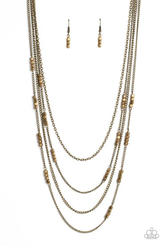 Paparazzi Accessories Metallic Monarch - Brass Glistening brass chains, sporadically infused with a quartet of brass beads link into fashionable layers below the neckline for a monochromatic medley. Features an adjustable clasp closure. Sold as one indivi