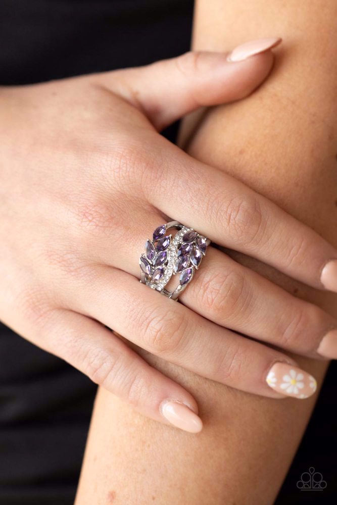 Paparazzi Accessories Luminously Leafy - Purple Clusters of amethyst marquise-cut crystals flank a wavy band of dainty white rhinestones atop the finger. The amethyst crystals fall into a leafy pattern, adding a touch of earthy elegance to the luminously