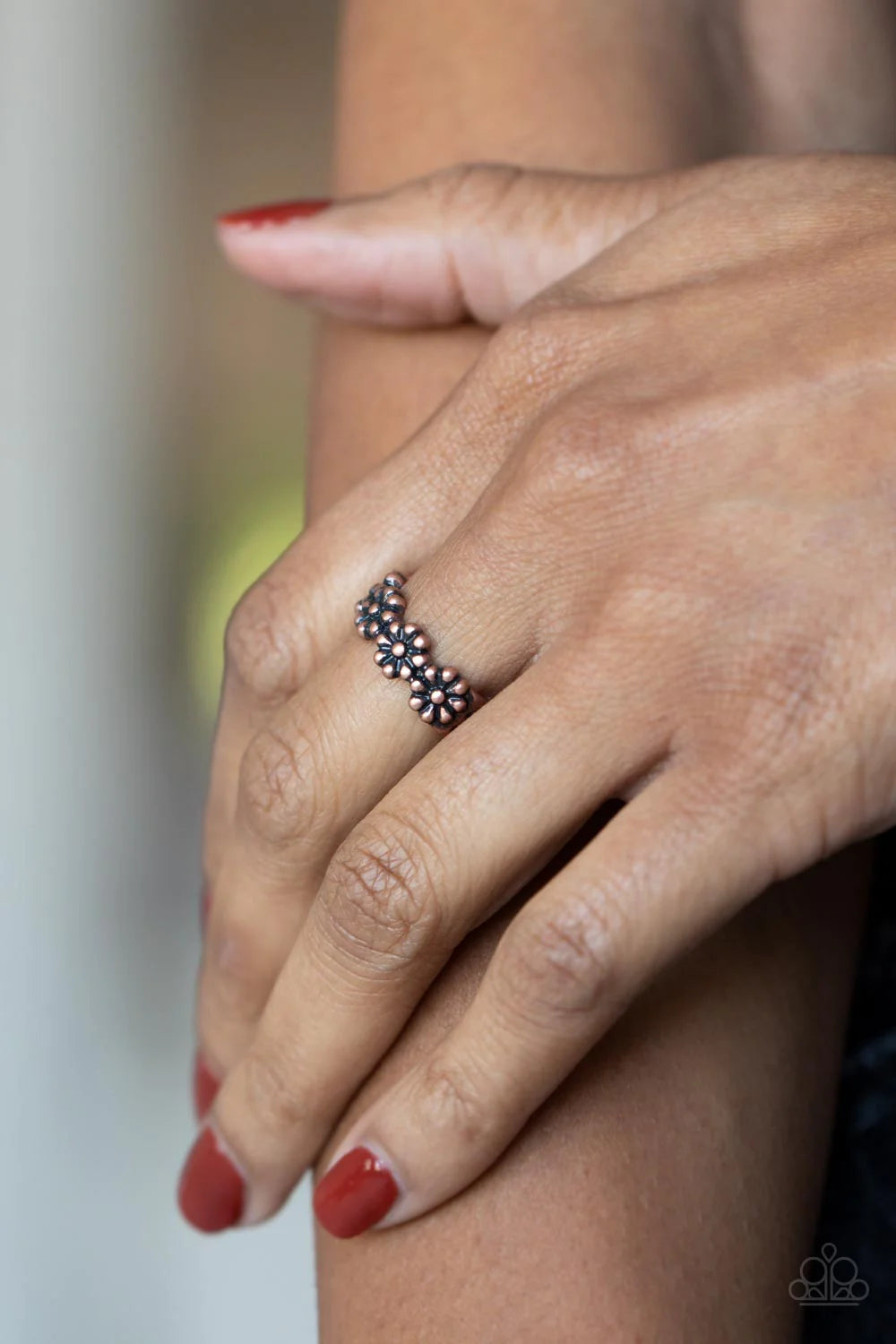 Paparazzi Accessories Farmhouse Fashion - Copper An antiqued collection of copper studs delicately coalesce into a dainty band of daisies across the finger, creating a rustic centerpiece. Features a dainty stretchy band for a flexible fit. Sold as one ind