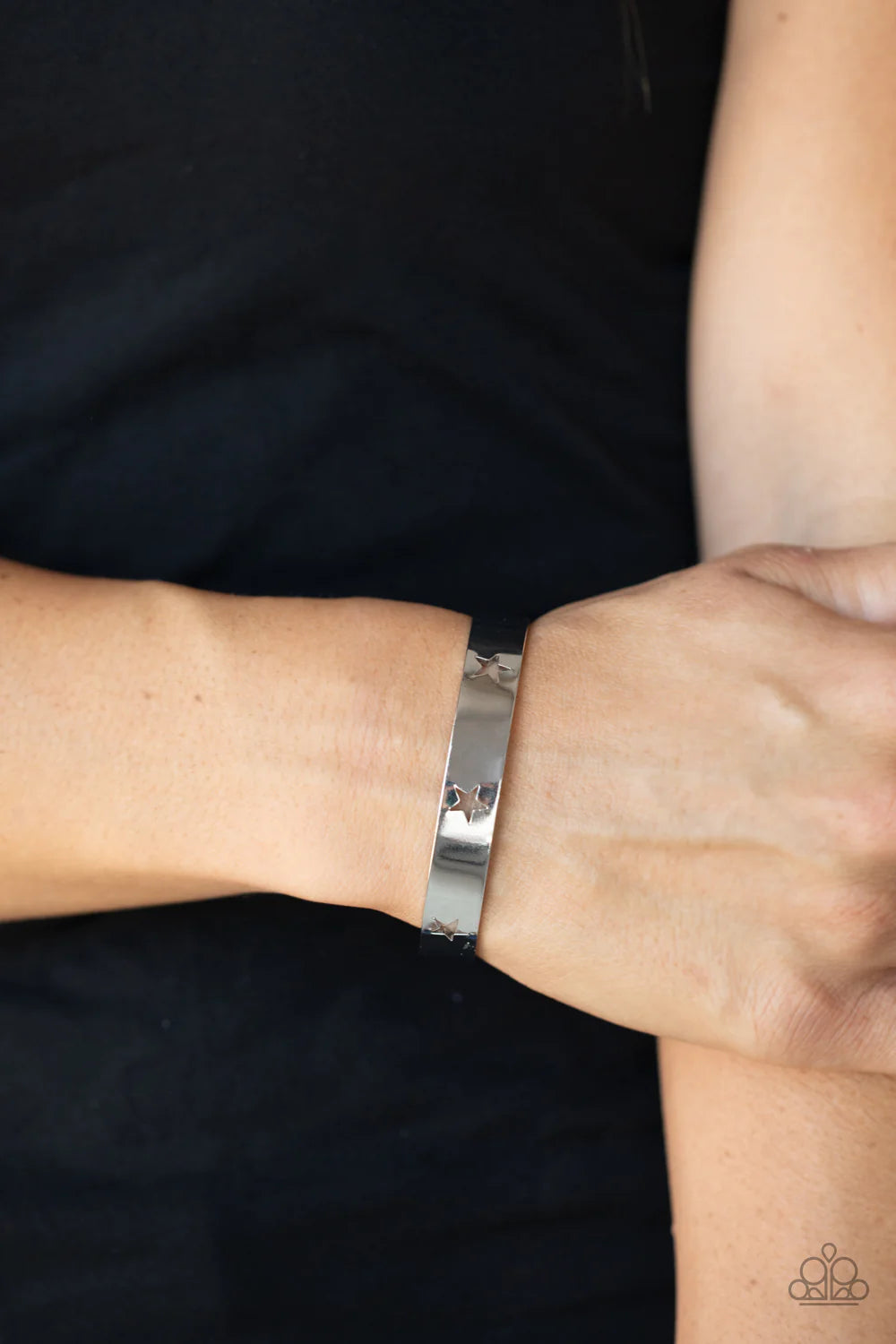 Paparazzi Accessories American Girl Glamour - Silver Airy silver stars are cutout along a classic silver cuff, creating a stellar centerpiece around the wrist. Sold as one individual bracelet. Jewelry