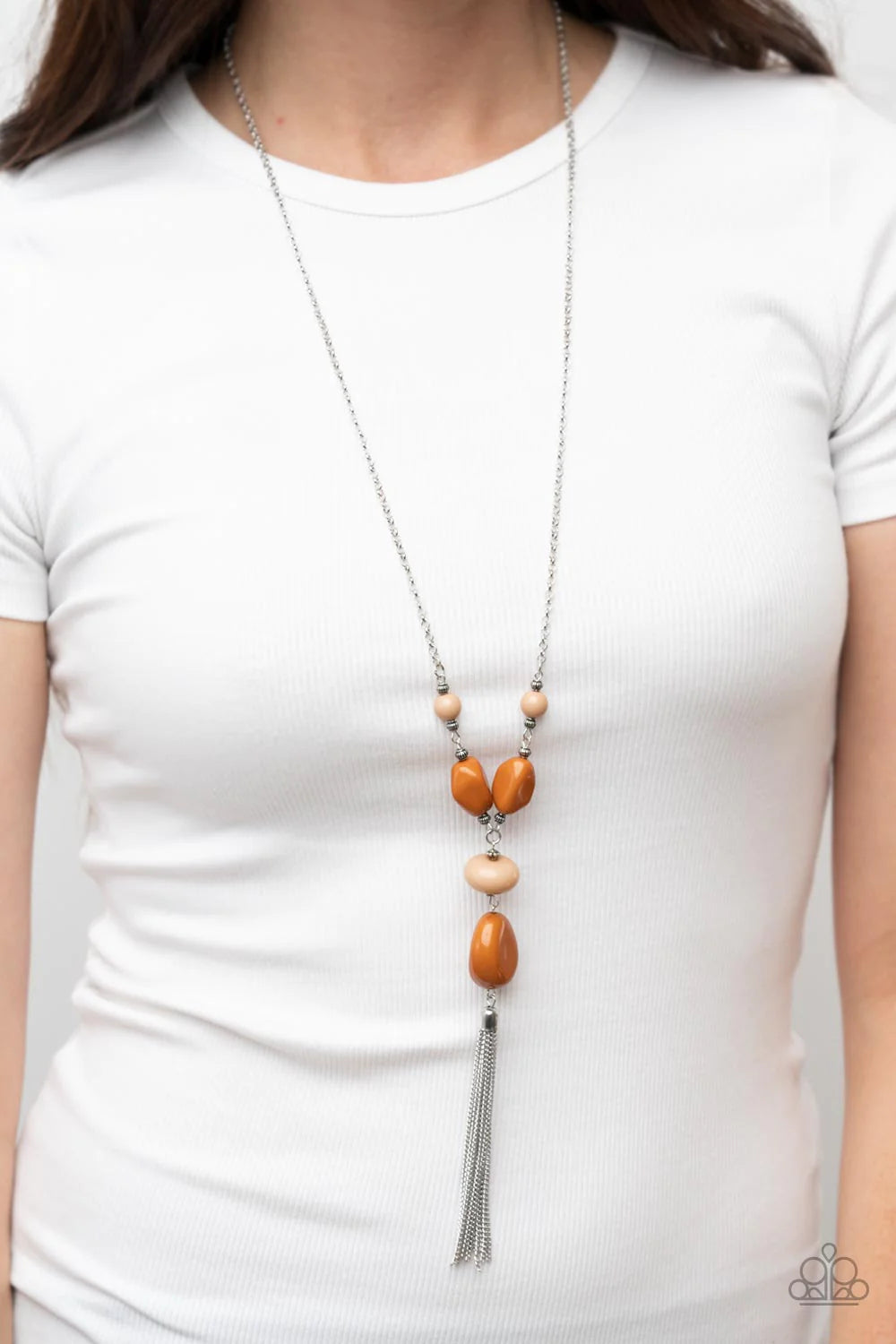 Paparazzi Accessories Heavenly Harmony - Brown Featuring faceted, rounded, and asymmetrical shapes, a mismatched collection of Adobe and Soybean acrylic beads alternates with textured silver beads along an extended silver chain. A shimmery silver chain ta