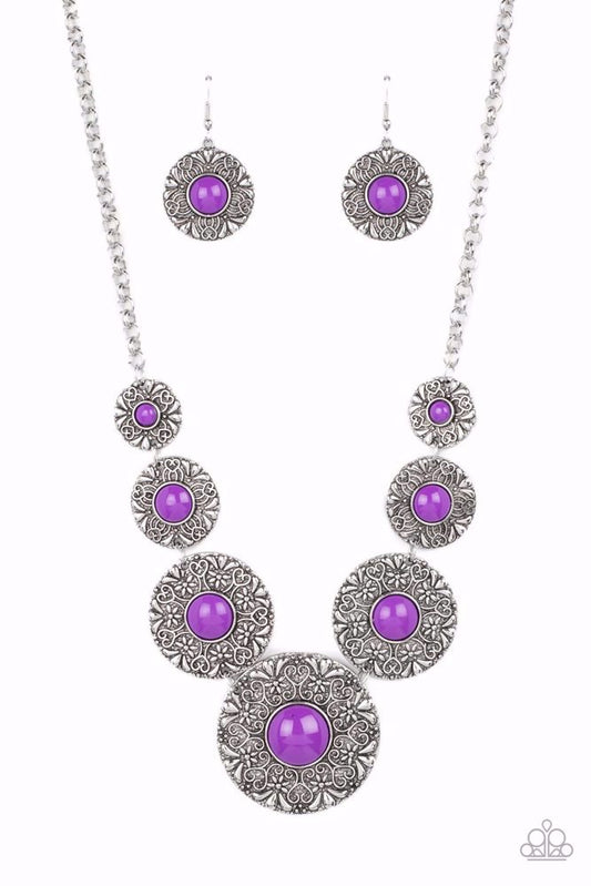 Paparazzi Accessories Garden Glade - Purple Dotted with Dahlia beaded centers, floral embossed silver discs gradually increase in size as they link below the collar for a flowery pop of color. Features an adjustable clasp closure. Sold as one individual n