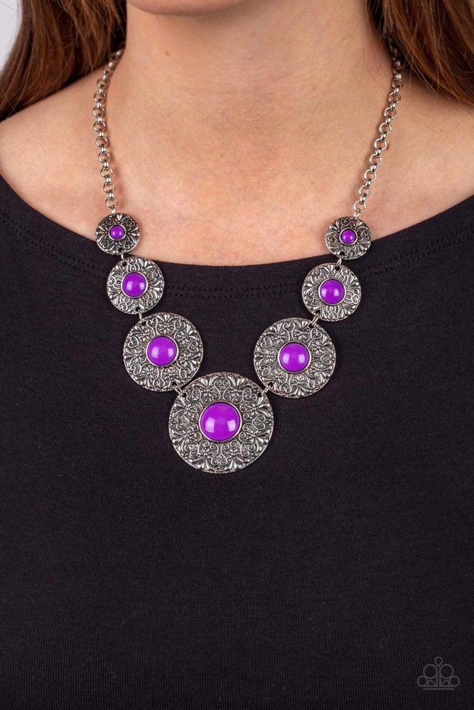 Paparazzi Accessories Garden Glade - Purple Dotted with Dahlia beaded centers, floral embossed silver discs gradually increase in size as they link below the collar for a flowery pop of color. Features an adjustable clasp closure. Sold as one individual n