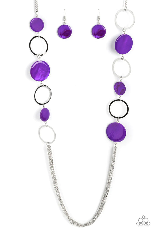 Paparazzi Accessories Beach Hub - Purple Sections of purple shell-like discs link with flat silver hoops down the chest, giving way to layers of shimmery silver chain for a tropical inspired flair. Features an adjustable clasp closure. Sold as one individ