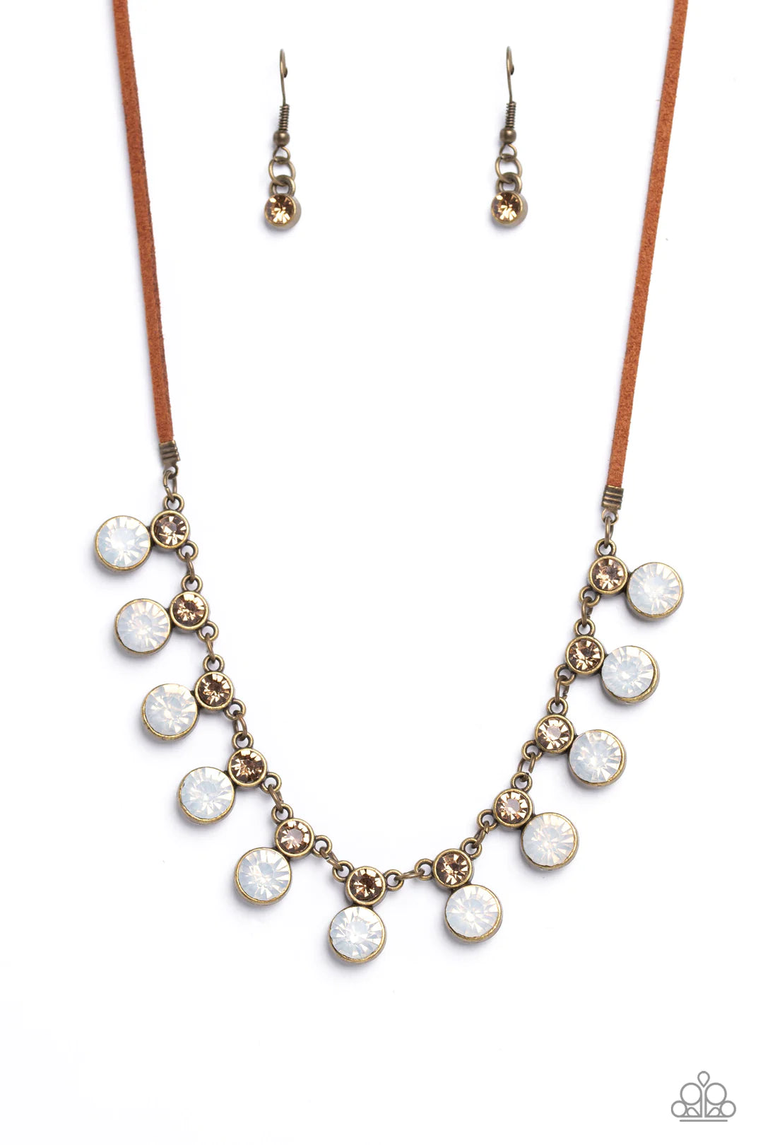 Paparazzi Accessories Color Me Chic - Brass A collection of oversized, opalescent rhinestones, set in brass frames attaches to a collection of topaz rhinestones set in similar frames. Strung along a brass chain, the sparkly collection attaches to a strand