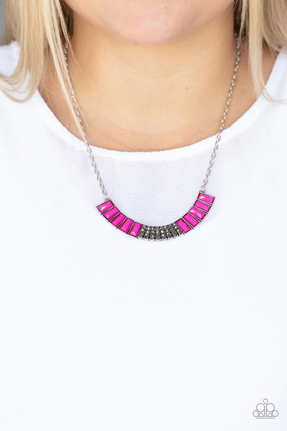 Paparazzi Accessories Coup de MANE - Pink Stacked rows of hematite rhinestones and faceted emerald cut Fuchsia Fedora beads coalesce into a colorful half moon pendant, creating a vivacious pop of color below the collar. Features an adjustable clasp closur