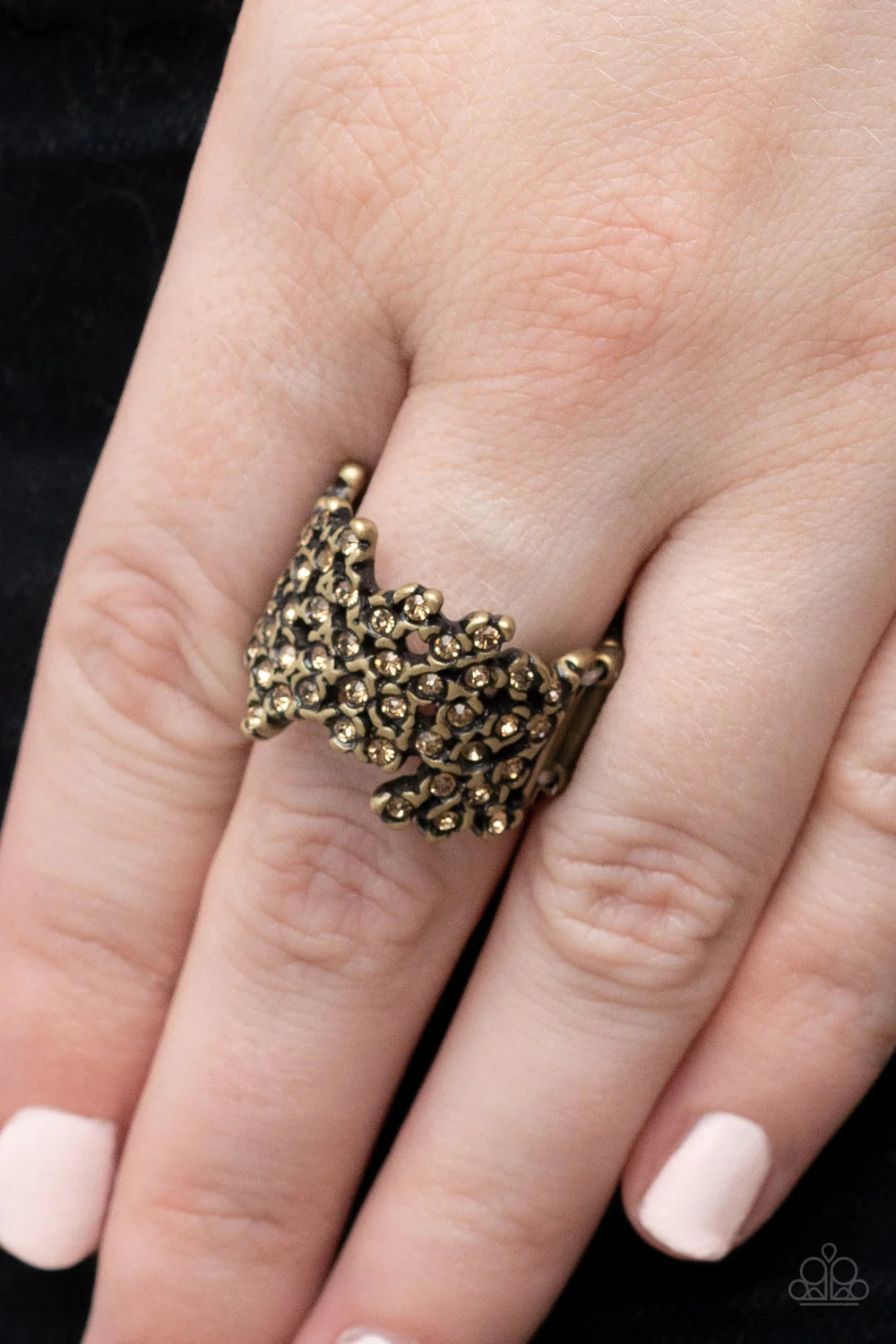 Paparazzi Accessories Sizzling Shimmer - Brass Enhanced with brass fittings, golden topaz rhinestones scatter across the finger for a subtle shimmer. Features a stretchy band for a flexible fit. Sold as one individual ring. Jewelry