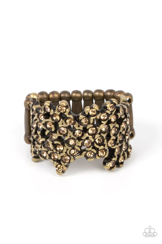 Paparazzi Accessories Sizzling Shimmer - Brass Enhanced with brass fittings, golden topaz rhinestones scatter across the finger for a subtle shimmer. Features a stretchy band for a flexible fit. Sold as one individual ring. Jewelry