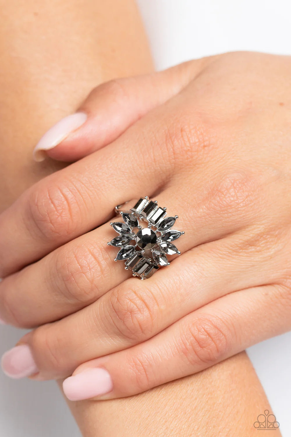 Paparazzi Accessories Untamable Universe - Silver Marquise-cut rhinestone petals, splashed in a smoky finish, fan out in an abstract manner around a hematite center. Dramatic emerald-cuts of hematite, fall in line along twisting bands of silver, exploding