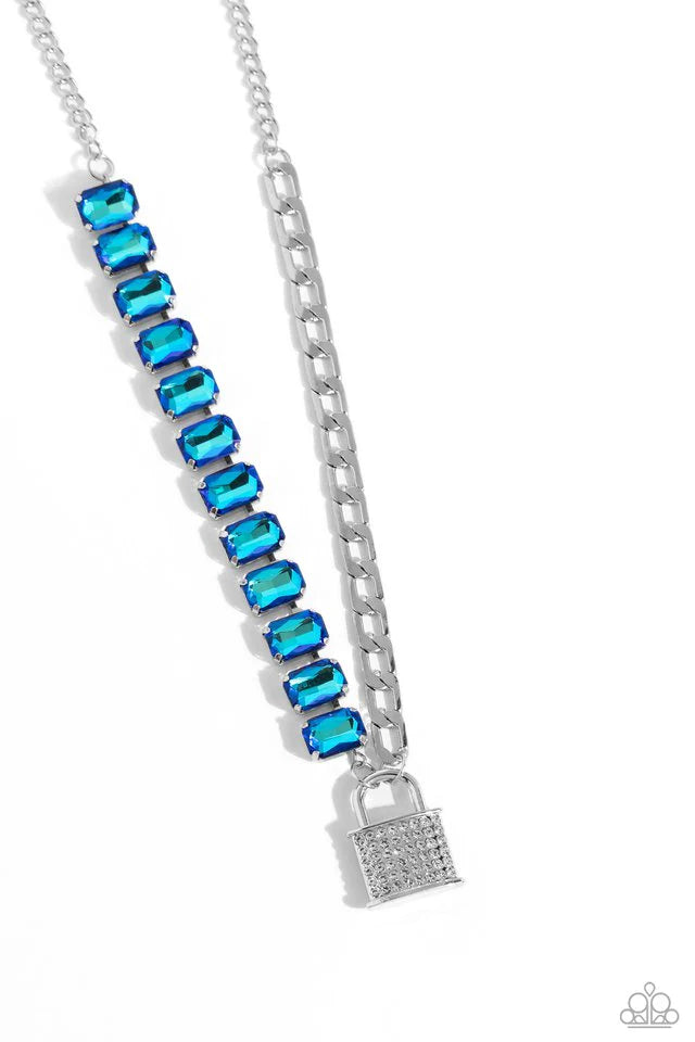 Paparazzi Accessories LOCK and Roll - Blue Infused on a classic silver chain, a strand of thick silver curb chain, and a collection of exaggerated, blue UV radiant-cut gems in silver pronged fittings combine to create a collision of industrial color aroun