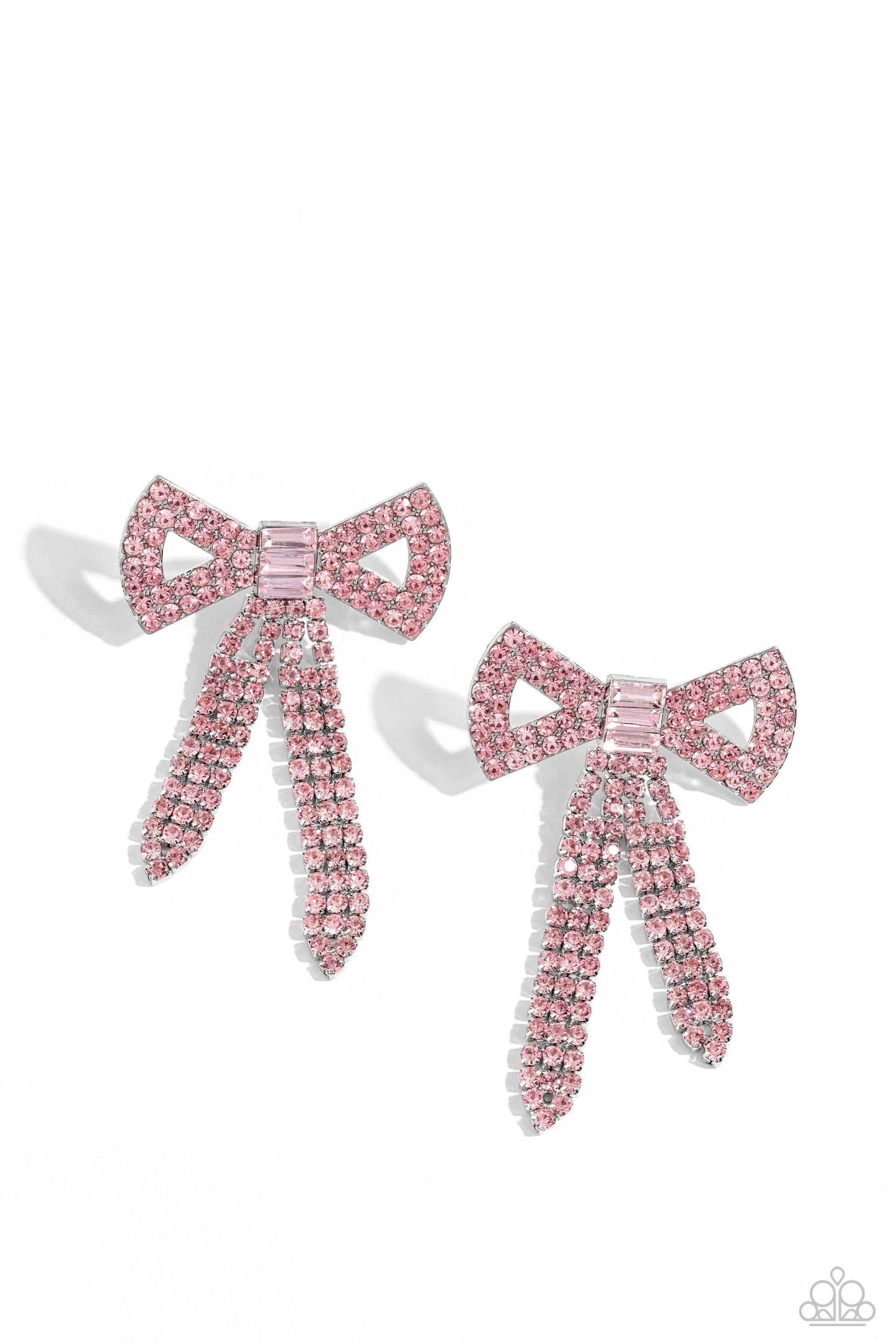 Paparazzi Accessories Just Bow With It - Pink Featuring silver square fittings, high-sheen bands of silver, adorned in sparkling pink rhinestones loop into a stunning bow charm, creating a classy statement at the ear. Featured in the center of the classy