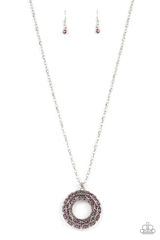 Paparazzi Accessories Wintry Wreath - Pink Dotted with glittering pink rhinestones and filled with frilly silver filigree accents, an oversized silver wreath sparkles from the bottom of an extended silver chain for a whimsical fashion. Features an adjusta