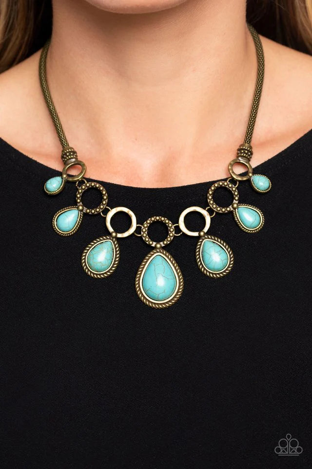 Paparazzi Accessories Riverside Relic - Brass An airy mesh chain gives way to a collection of brass rings that link along the collar. A rustic dot motif decorates three of the rings, alternating with the remaining hoops that feature a subtle hammered text