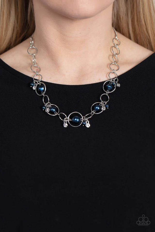 Paparazzi Accessories Think of the POSH-ibilities - Blue Threaded along dainty rods, a bubbly collection of imperfect beads seemingly float inside silver rings as they delicately connect below the collar. Dainty clusters of Montana beads and white rhinest