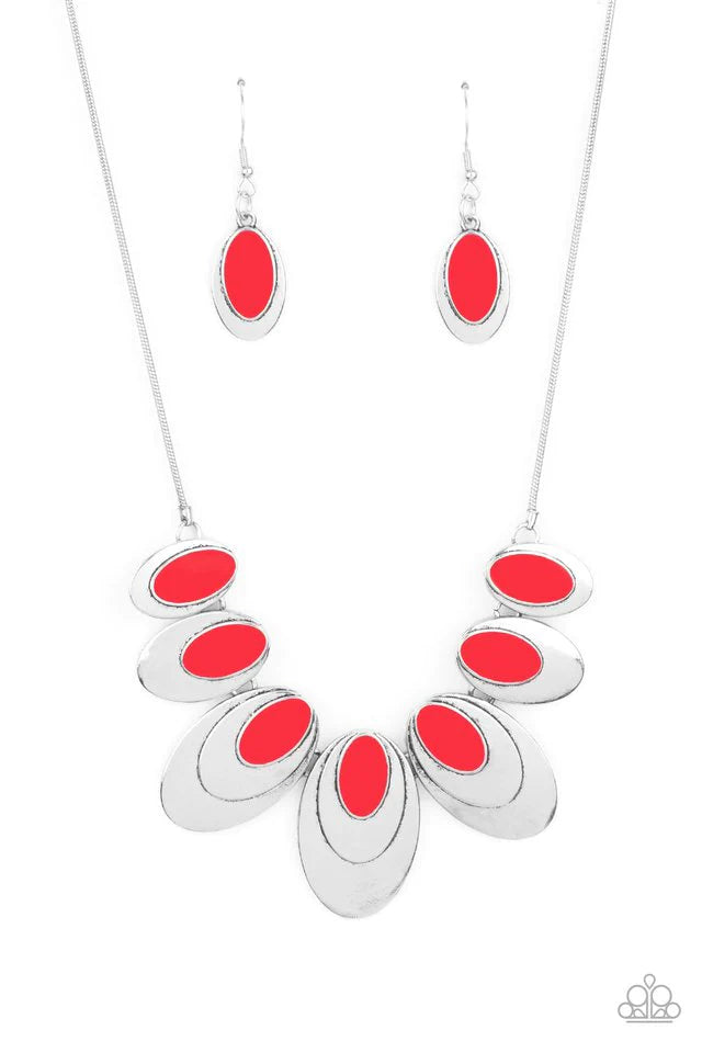 Paparazzi Accessories Endless Eclipse - Red A row of stacked oval silver plates in graduating sizes, crowned with a glossy red oval, link together and connect to a round silver chain creating an out-of-this-world statement below the collar. Features an ad