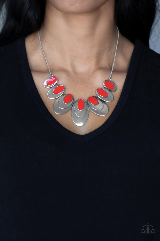 Paparazzi Accessories Endless Eclipse - Red A row of stacked oval silver plates in graduating sizes, crowned with a glossy red oval, link together and connect to a round silver chain creating an out-of-this-world statement below the collar. Features an ad
