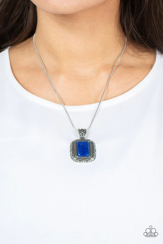 Paparazzi Accessories Right Hand TALISMAN - Blue A rectangular lapis lazuli stone is pressed into the center of a studded silver frame bordered in decorative filigree at the bottom of a rounded silver snake chain, creating a mystical talisman below the co