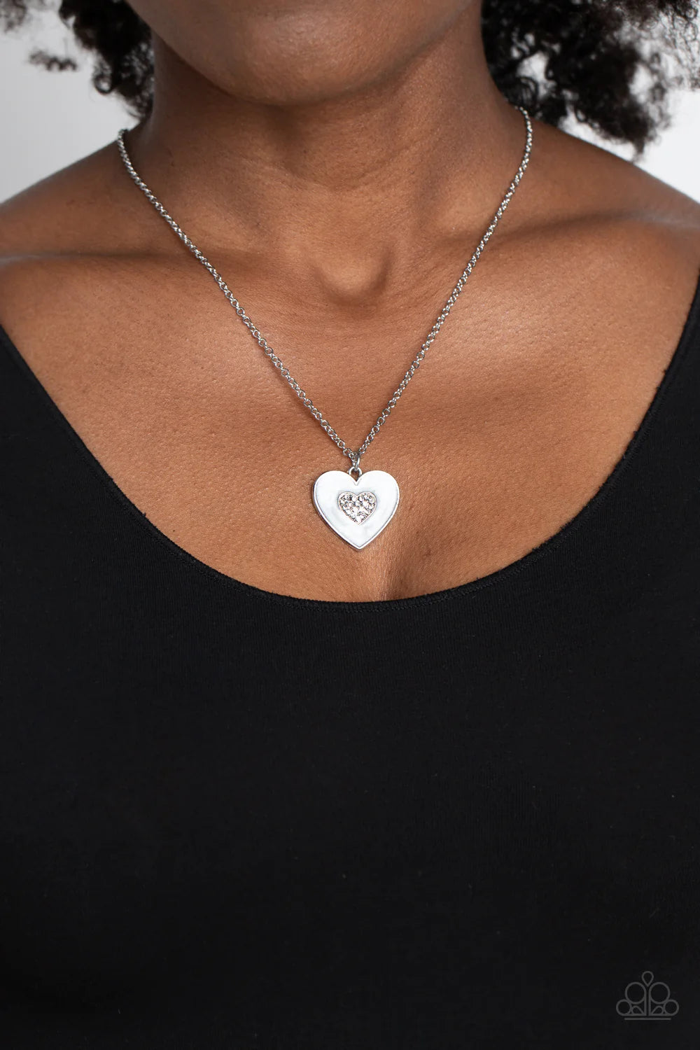 Paparazzi Accessories So This is Love - White Painted in a shimmery white lacquer finish, a silver heart swings from the bottom of a dainty silver chain below the collar for a charming finish. Featured in the center of the white backdrop, a smaller heart,