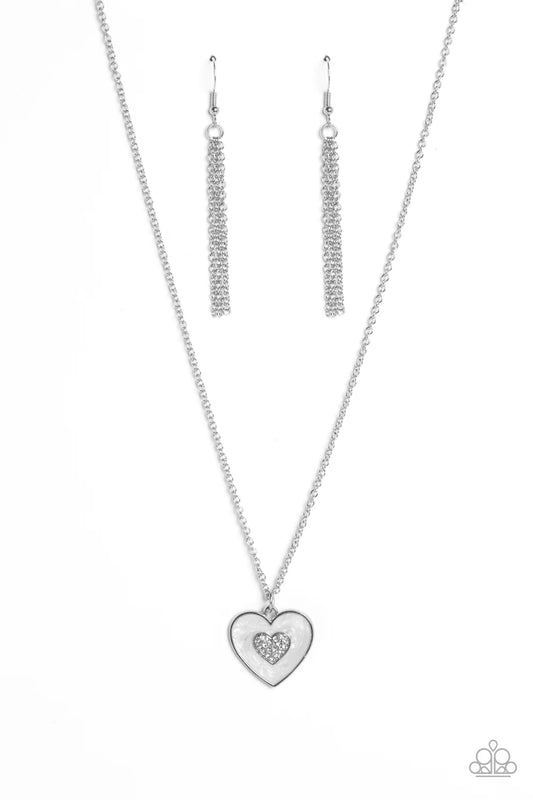 Paparazzi Accessories So This is Love - White Painted in a shimmery white lacquer finish, a silver heart swings from the bottom of a dainty silver chain below the collar for a charming finish. Featured in the center of the white backdrop, a smaller heart,