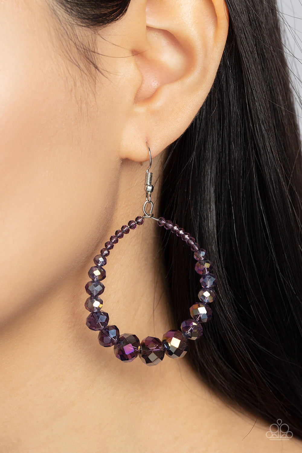Paparazzi Accessories Astral Aesthetic - Purple Featuring a flashy faceted finish, purple gems with a kaleidoscopic overlay gradually increase in size as they glide along a wire hoop, resulting in a stellar teardrop. Earring attaches to a standard fishhoo