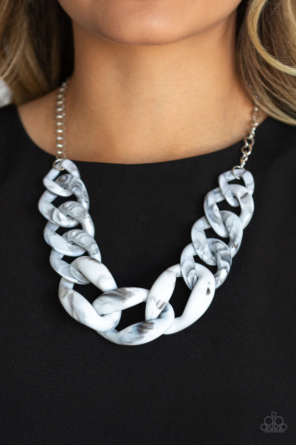 Paparazzi Accessories Red- Haute - White Featuring a faux marble finish, white acrylic links gradually increase in size as they link below the collar in a statement-making fashion. Features an adjustable clasp closure. Sold as one individual necklace. Inc
