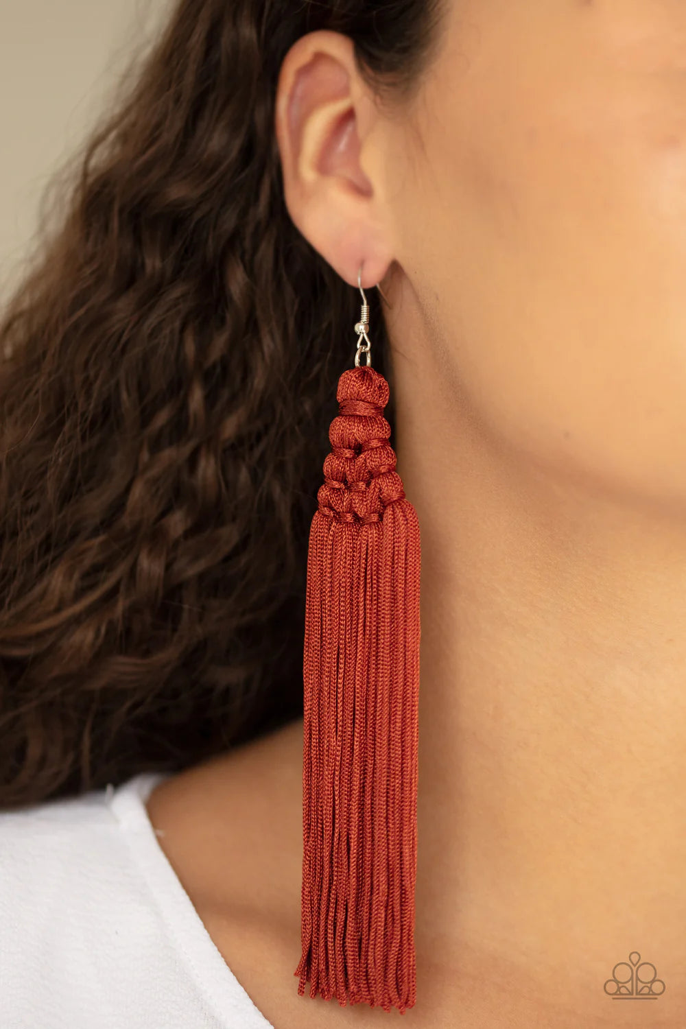 Paparazzi Accessories Magic Carpet Ride - Red Woven into an intricate frame, shiny Cinnamon Stick tassels stream from the ear, creating a majestic fringe. Earring attaches to a standard fishhook fitting. Sold as one pair of earrings. Jewelry