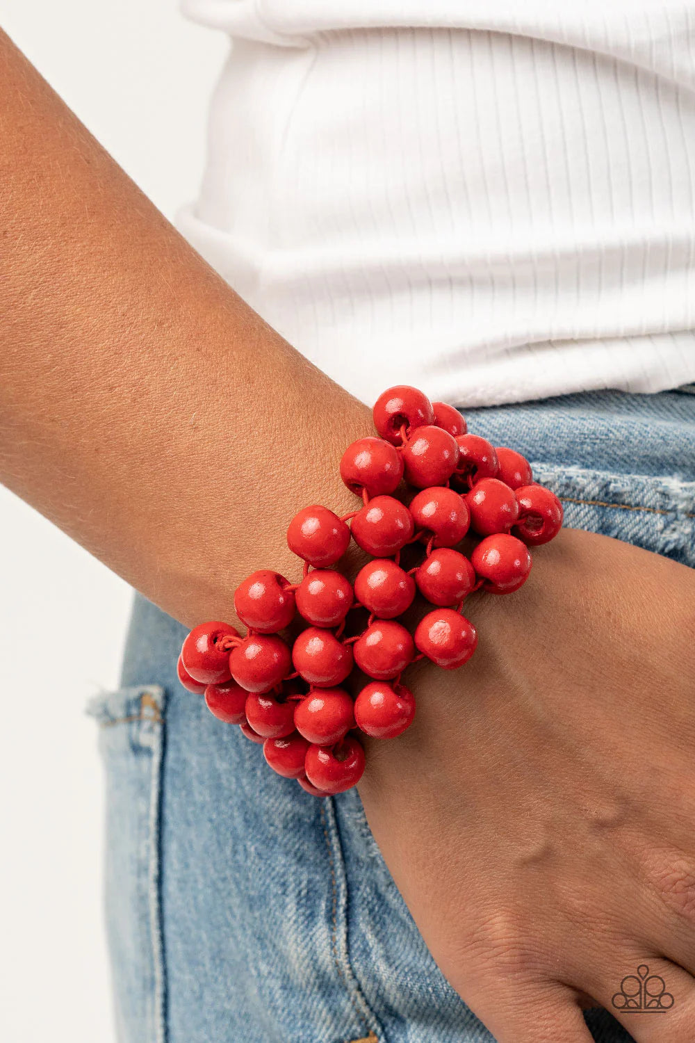 Paparazzi Accessories Tiki Tropicana - Red An oversized collection of fiery red wooden beads are threaded along stretchy bands that ornately weave across the wrist, creating a decorative summery pattern. Sold as one individual bracelet. Jewelry