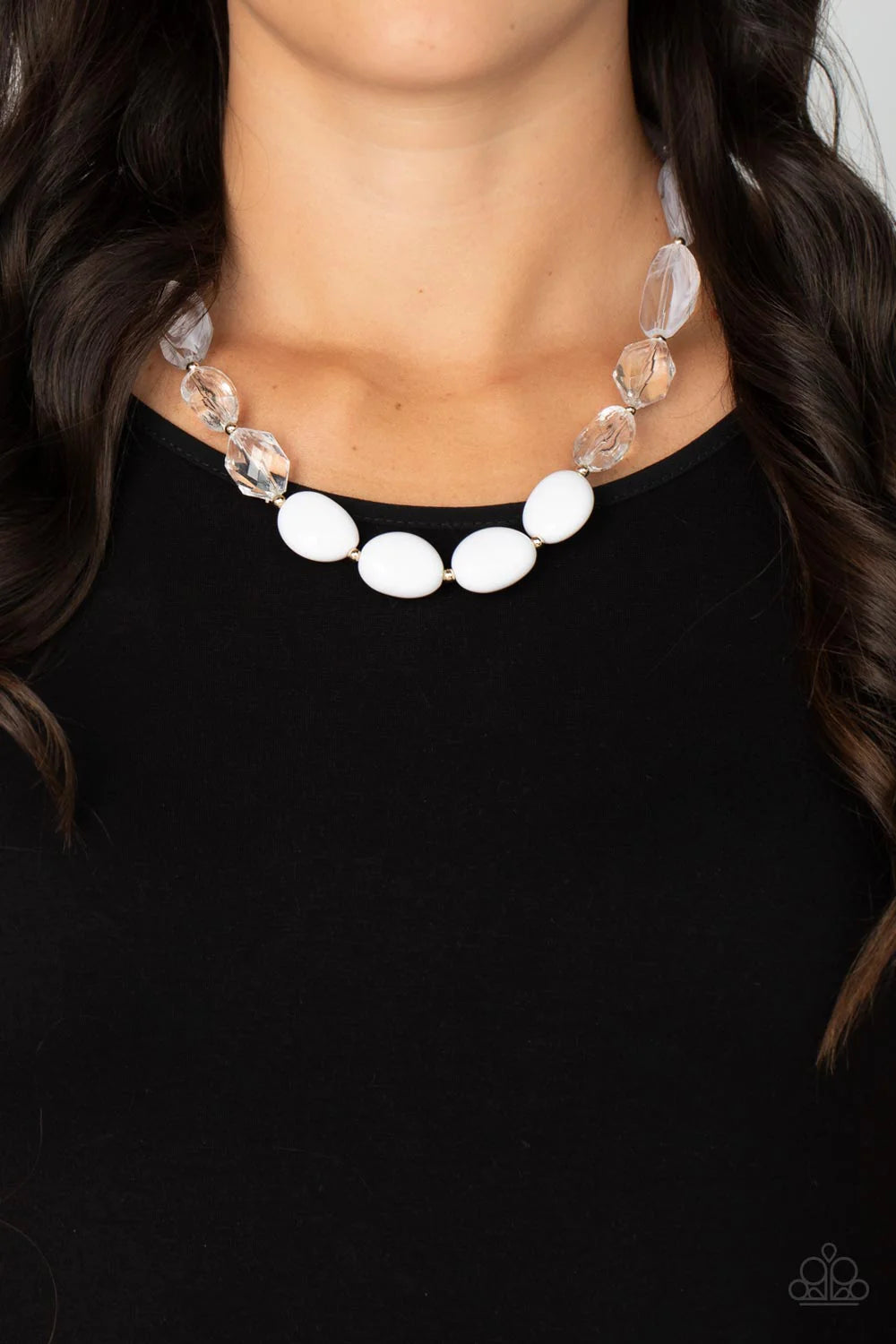 Paparazzi Accessories Private Paradise - White Separated by dainty gold beads, mismatched sections of icy, crystal-like, and white acrylic beads are threaded along an invisible wire across the chest for a colorful flair. Features an adjustable clasp closu