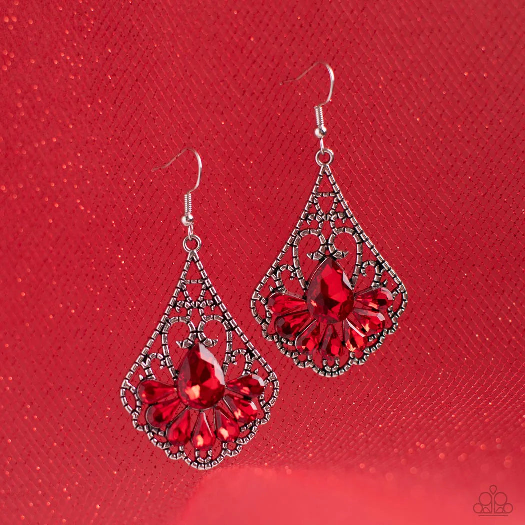 Paparazzi Accessories Exemplary Elegance - Red A sparkly collection of fiery red teardrop rhinestones fan out across the bottom of a textured filigree filled teardrop frame, creating an elegant centerpiece. Earring attaches to a standard fishhook fitting.