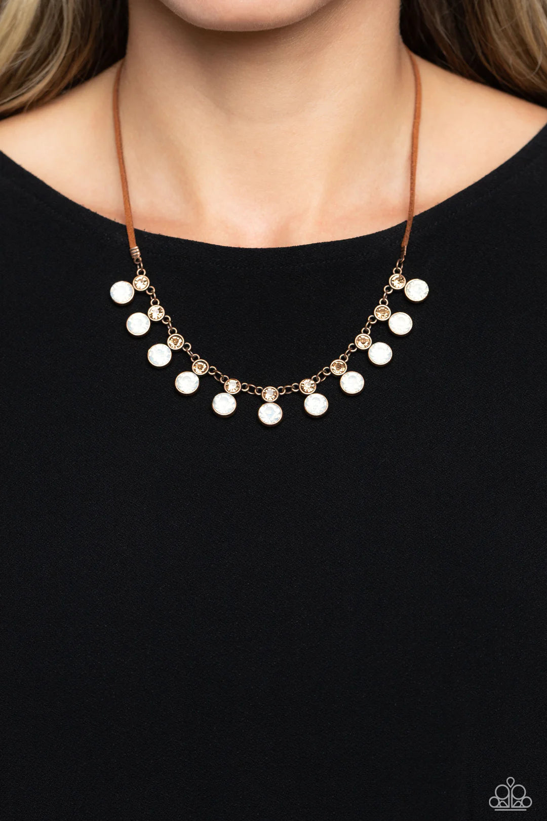 Paparazzi Accessories Color Me Chic - Copper A collection of oversized, opalescent rhinestones, set in copper frames attaches to a collection of topaz rhinestones set in similar frames. Strung along a copper chain, the sparkly collection attaches to a str