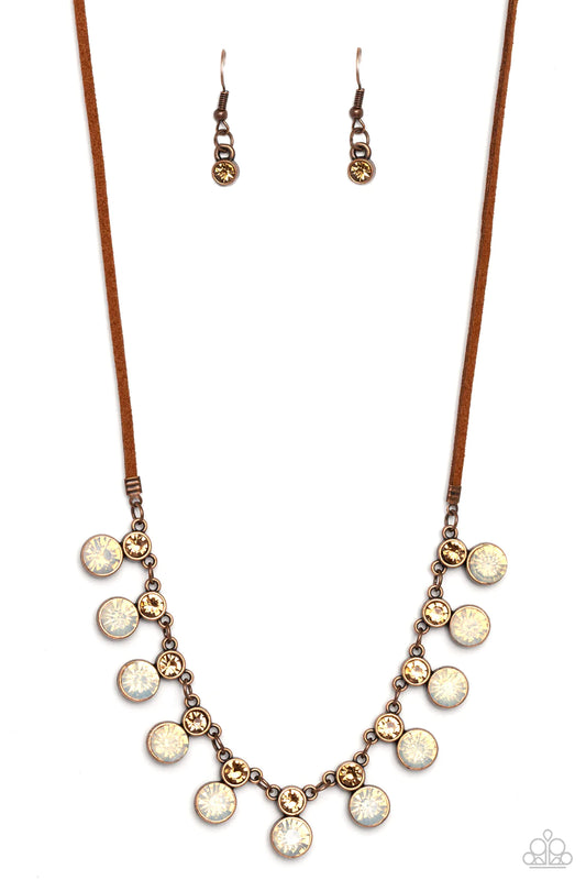 Paparazzi Accessories Color Me Chic - Copper A collection of oversized, opalescent rhinestones, set in copper frames attaches to a collection of topaz rhinestones set in similar frames. Strung along a copper chain, the sparkly collection attaches to a str