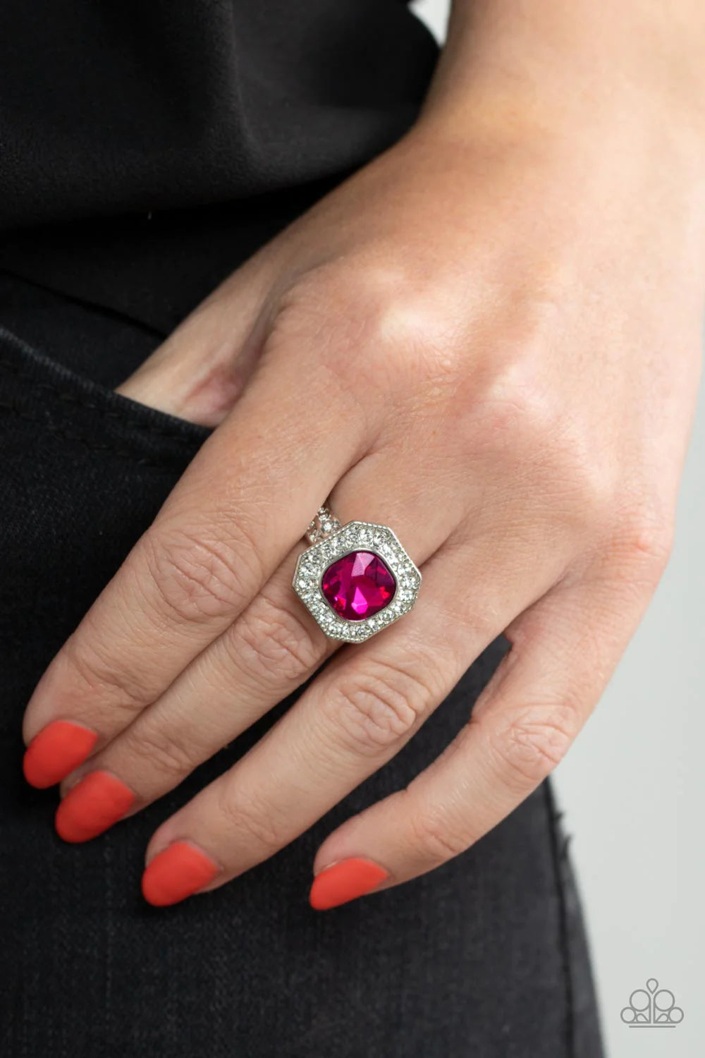 Paparazzi Accessories Title Match - Pink Bordered in a sparkly silver frame of glassy white rhinestones, an oversized pink gem adorns the finger for a timeless finish. Features a dainty stretchy band for a flexible fit. Sold as one individual ring. Jewelr