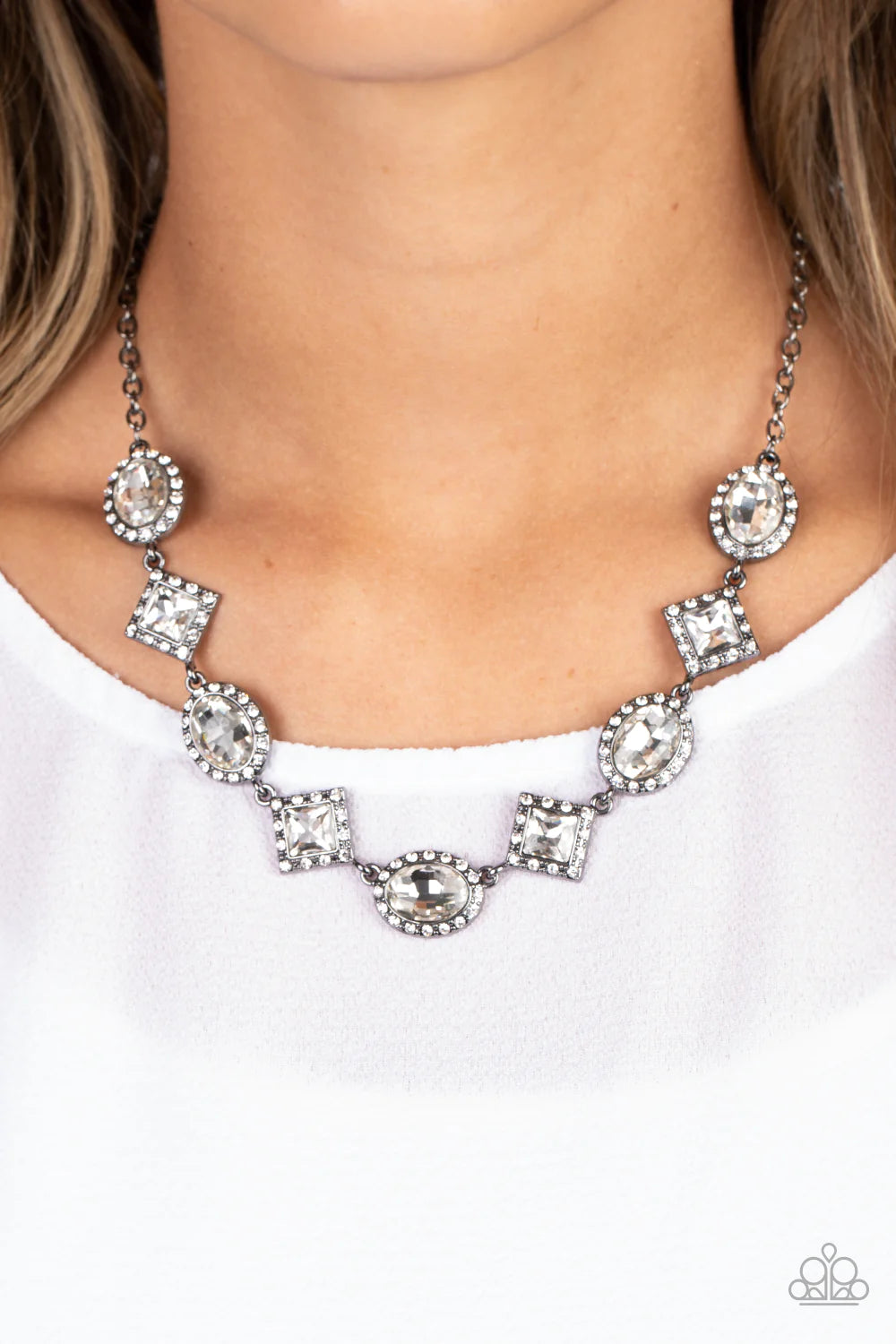 Paparazzi Accessories Diamond of the Season - Black Dazzling white rhinestones, in both oval and square cuts, fall along the collar in an alternating pattern. Each gem is set against a backdrop of gunmetal and bordered by tiny white rhinestones, amplifyin