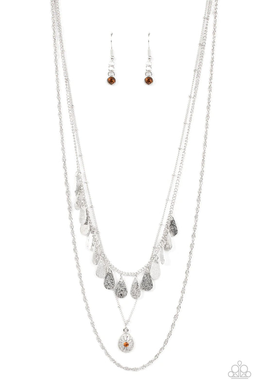 Paparazzi Accessories Prairie Dream - Brown Classic silver, satellite, and twisted chains daintily layer below the collar. A topaz rhinestone dotted teardrop swings from the middle chain below a fringe of shimmery silver teardrops, resulting in a dreamy d