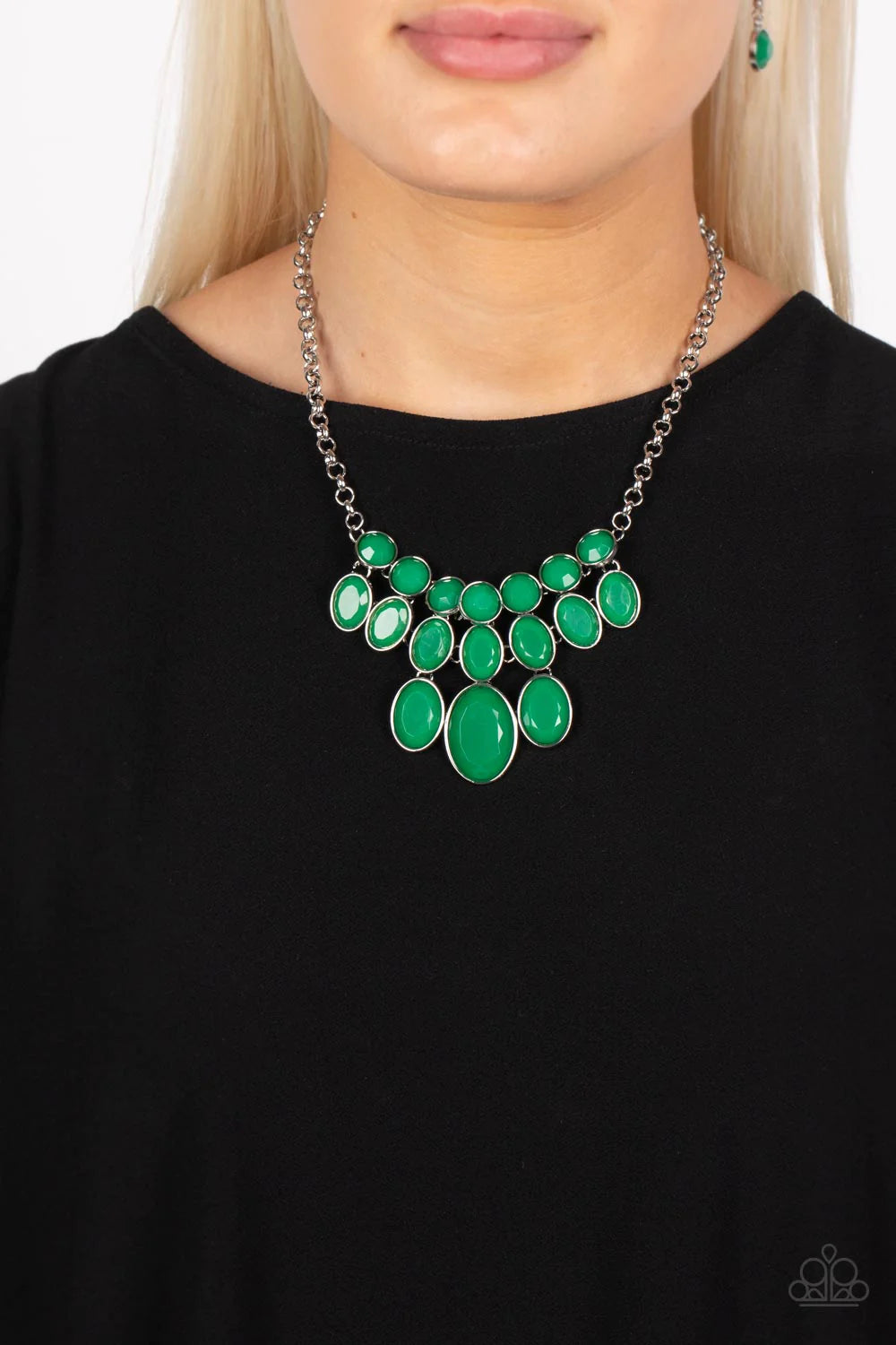 Paparazzi Accessories Delectable Daydream - Green A decadent collection of faceted leprechaun beads gradually increase in size as they fall into a tapered display. The smallest round beads anchor the design, with the rows underneath them slowly elongating