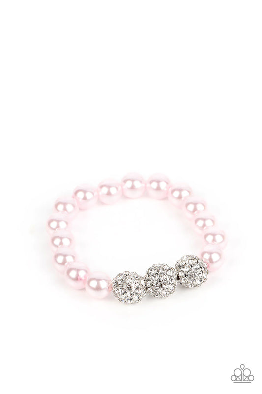 Paparazzi Accessories Breathtaking Ball - Pink A trio of silver beads encrusted in rhinestones is centered along a strand of classic baby pink pearls. The beads are threaded along a stretchy band, wrapping around the wrist in a refined finish. Sold as one