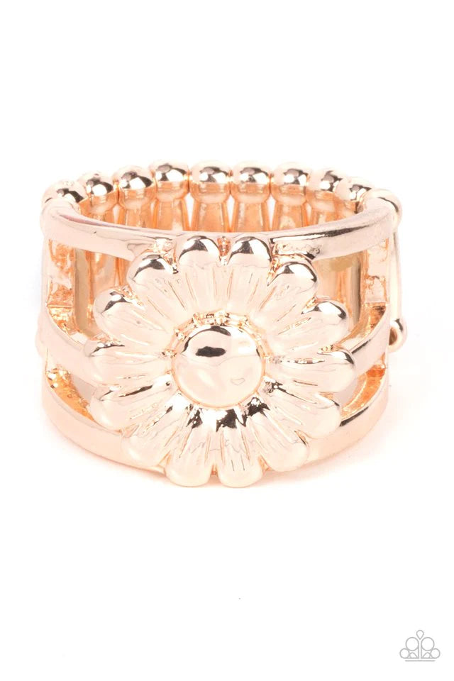 Paparazzi Accessories Roadside Daisies - Rose Gold Brushed in a glistening shimmer, a rose gold daisy blooms atop layered rose gold bands for a whimsical fashion. Features a stretchy band for a flexible fit. Jewelry