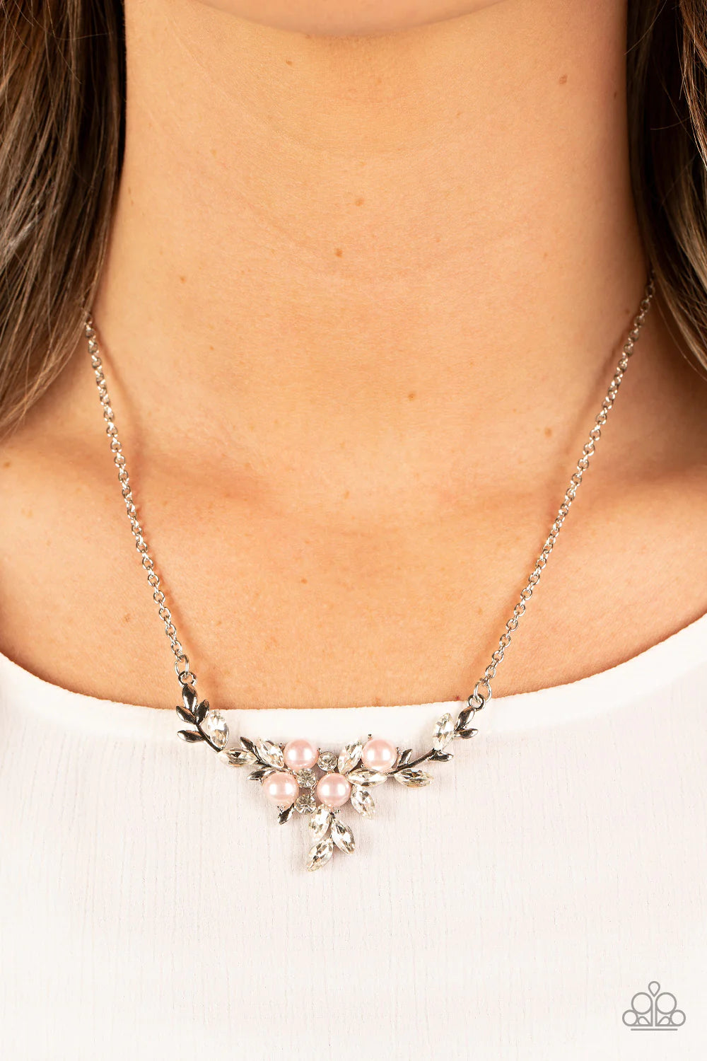 Paparazzi Accessories Because I’m the Bride - Pink Clusters of bubbly pink pearls and glassy white rhinestones delicately adorn dainty silver branches below the collar, resulting in a leafy elegance below the collar. Features an adjustable clasp closure.