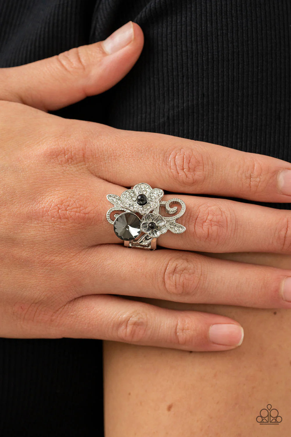 Paparazzi Accessories Bucketful of Bouquets - Black Dotted with dainty black bead centers, a textured silver blossom and white rhinestone dotted silver flower bloom around an oversized smoky gem. Studded silver filigree and white rhinestone dusted leafy f