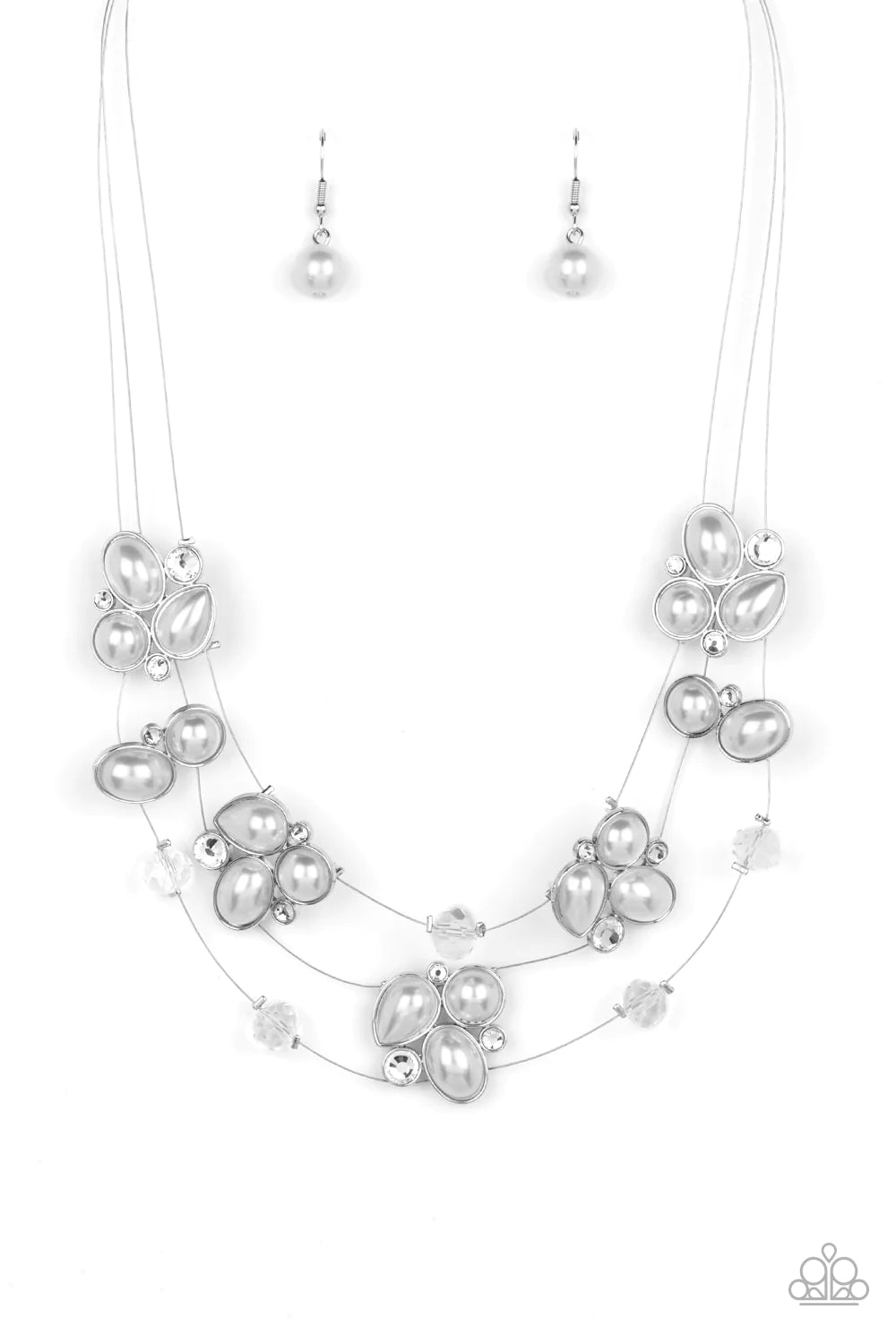 Paparazzi Accessories Snow Angels - White Strung along a trio of delicate silver wires, an ethereal collection of white crystal-like gems, clear faceted beads, and timeless pearls are pressed into teardrop, oval, and circular frames as they cluster along