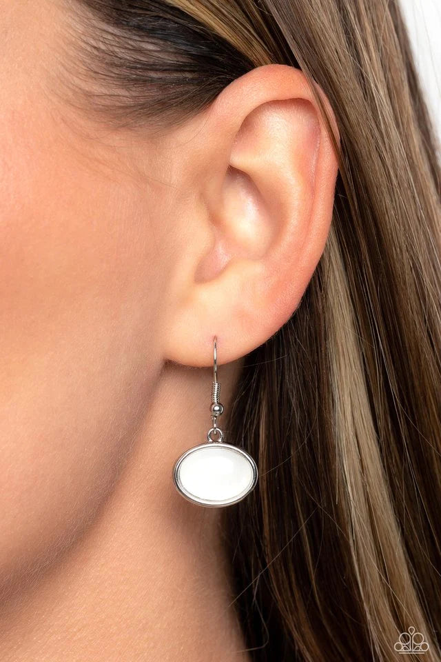 Paparazzi Accessories Geometric Glow - White Pressed in abstract silver frames, an opalescent, oversized, white acrylic piece and milky oval acrylic piece drips from the bottom of an elongated silver chain for a basic geometric design. Features an adjusta